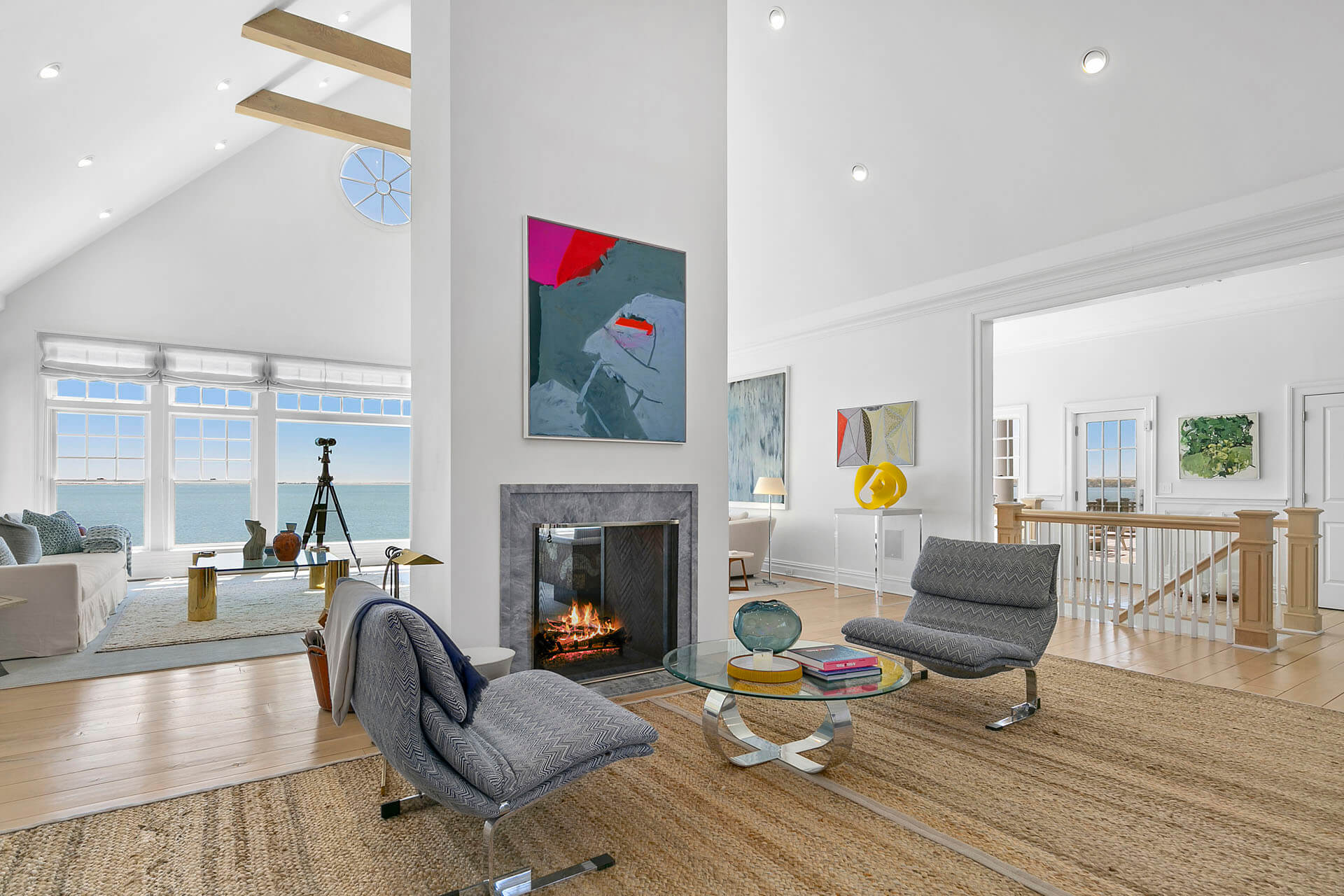 Seating area with a fireplace and ocean views